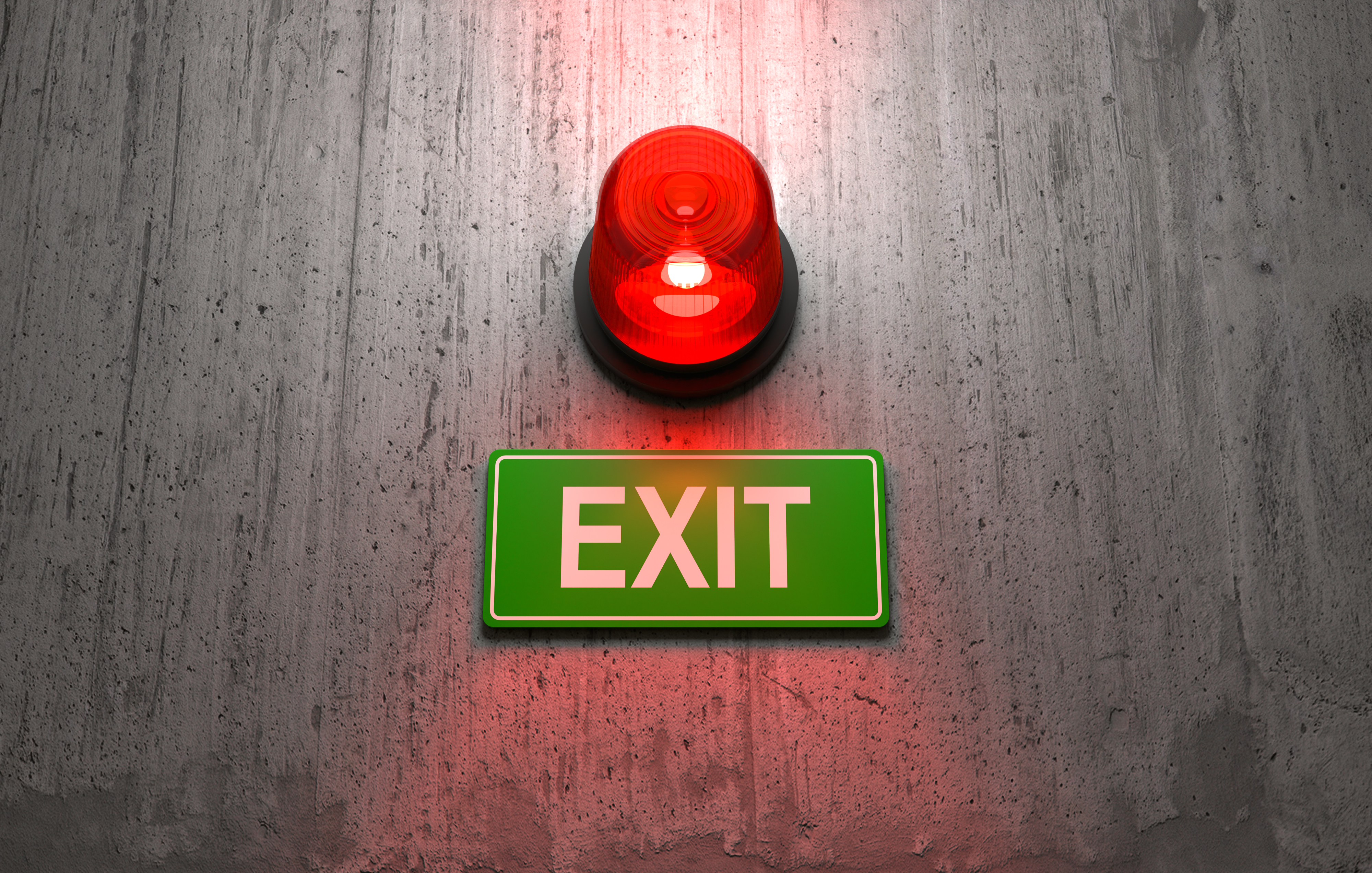 Exit-Schild mit leutender Warnlampe darüber